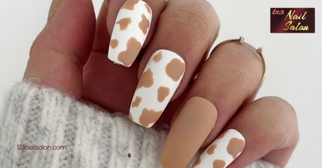 10 Fun Cow Print Nail Ideas to Make Your Manicure Stand Out 3 Brown and White Cow Print Nails